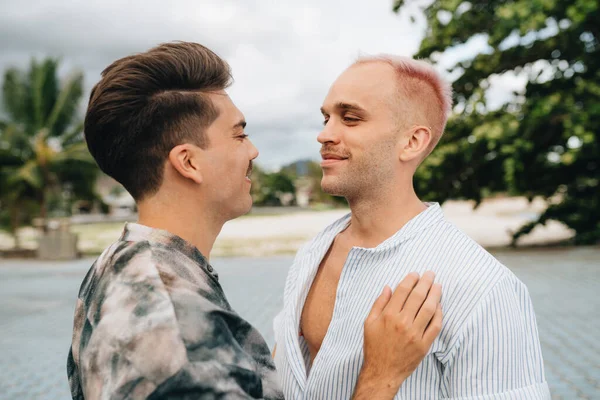 Gay Couple spend time together outdoors. Homosexual couple having fun together