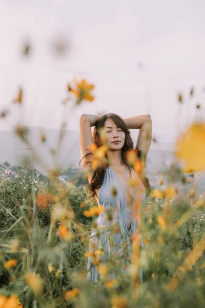 Portrait Asian Happy Young Woman Blue Dress Flower Field Mountains — стоковое фото