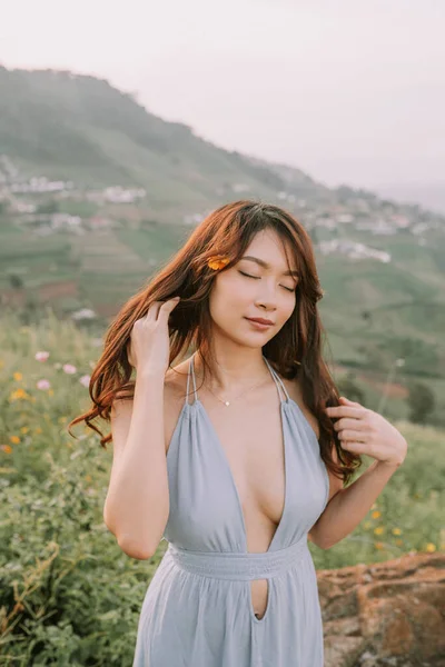 Portrait Asian Happy Young Woman Blue Dress Flower Field Mountains — 스톡 사진