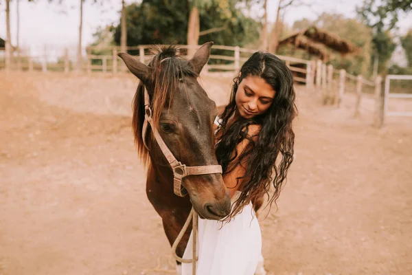 Woman in a white dress with a horse — Stock Photo, Image
