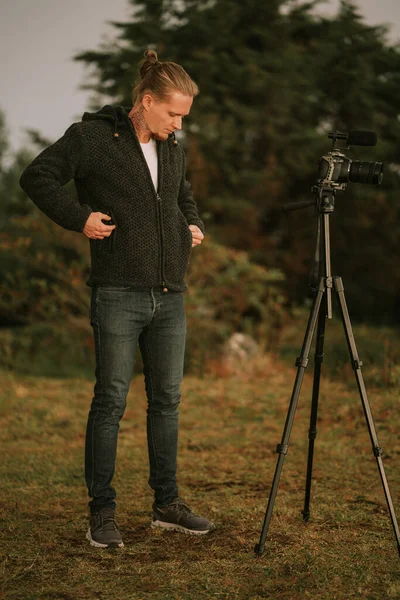 Man videographer making video of sunset at Doi Inthanon National Park Thailand. High quality photo