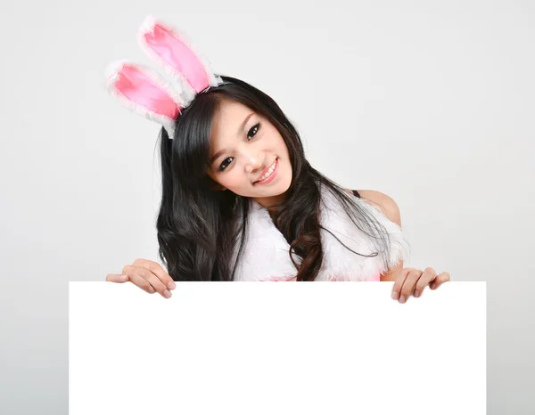 Sexy bunny girl hold white board — Stock Photo, Image