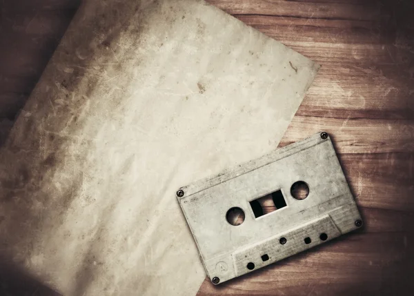 Old paper and cassette — Stock Photo, Image