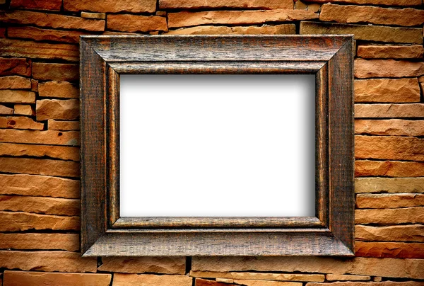 Wooden frame on brick wall — Stock Photo, Image