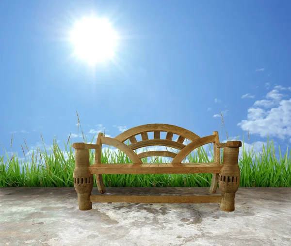 Wooden bench with blue sky — Stock Photo, Image
