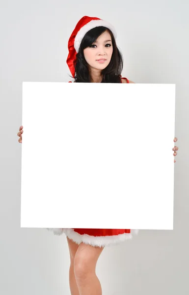 Santa femme tenant une affiche blanche — Photo