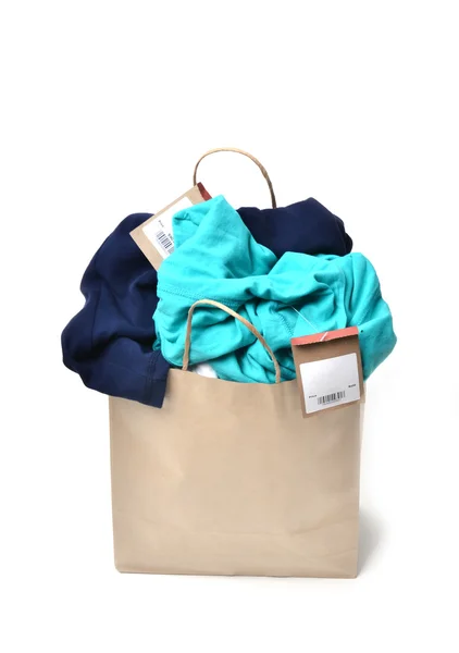 Clothes in a shopping bag — Stock Photo, Image