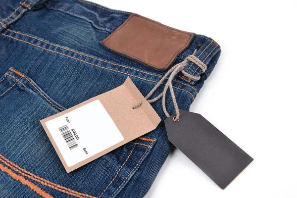 Price tag with barcode on  jeans — Stock Photo, Image