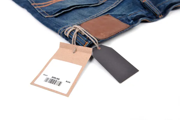 Etiqueta de preço com código de barras em jeans — Fotografia de Stock