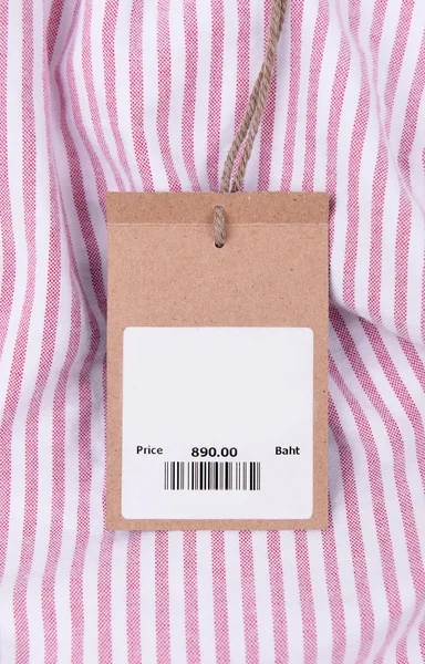 Price tag with barcode on shirt — Stock Photo, Image