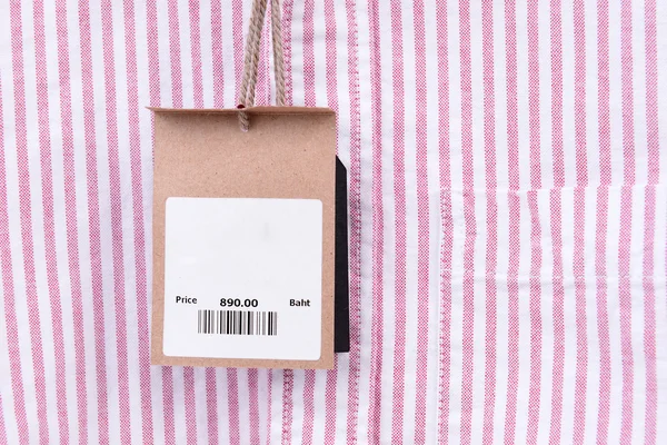 Price tag with barcode on shirt — Stock Photo, Image