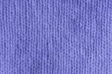 Örgü angora kumaş dokusu. Mercan yünü dokusu. Kabartma desenli örülmüş forma arka planı.