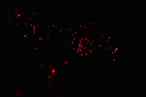 Festlich glitzernder roter und schwarzer Hintergrund. — Stockfoto