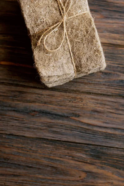 Packs of linen mats on white wooden background. — Stockfoto