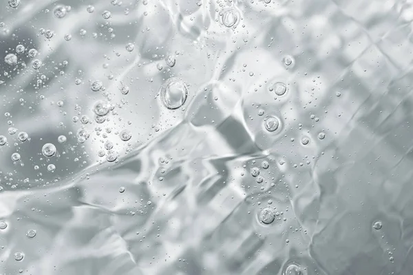 Närbild makro Aloe vera gel kosmetisk konsistens bakgrund med bubblor. — Stockfoto