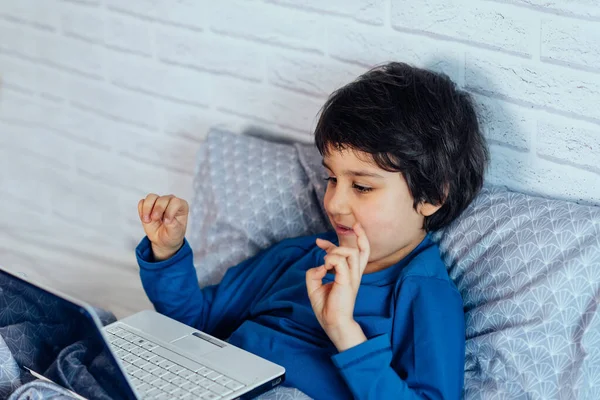 child on distance learning mental mathematics, arithmetic. children online education concept. Child using abacus. happy kid with laptop computer. school boy at home on pc app for distance learning