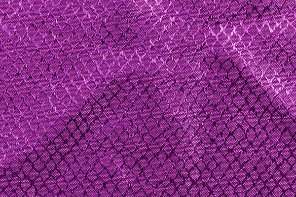 Purple fabric with embossed textures. Top view