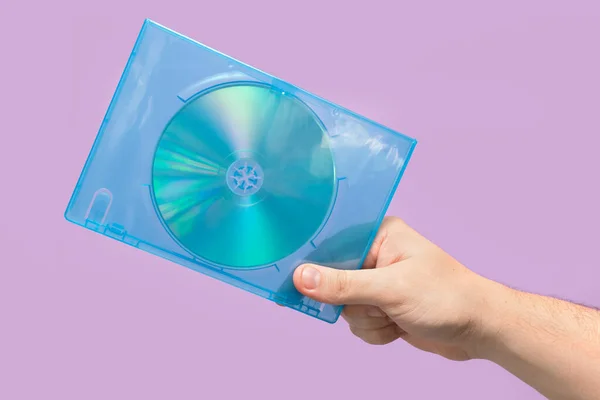 Dvd Box Hand Violet Background Front View — Stock Photo, Image
