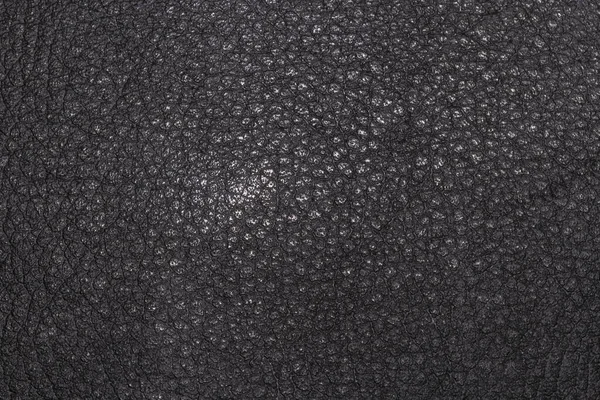Karanlık plastik doku ile parlayan buruşuk. Makro görünümü