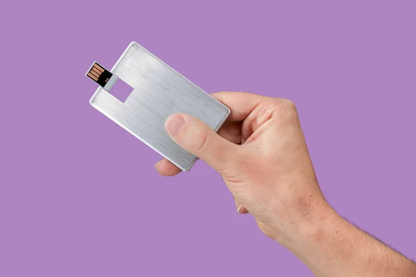 Card Usb Flash Drive Hand Isolated Violet Background Front View Stok Foto