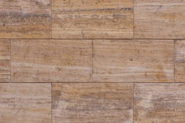 Kahverengi dikdörtgen taş duvar. Önden Görünüm