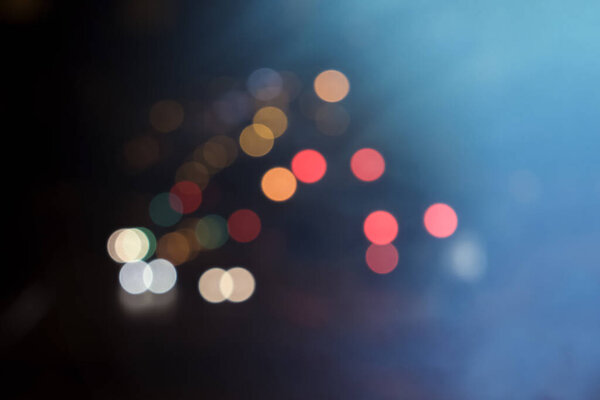 City night light blur bokeh, Circles of orange, red and white colors. Blurred background
