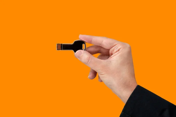 Key Usb Pen Drive Hand Isolated Orange Background Front View — Foto de Stock
