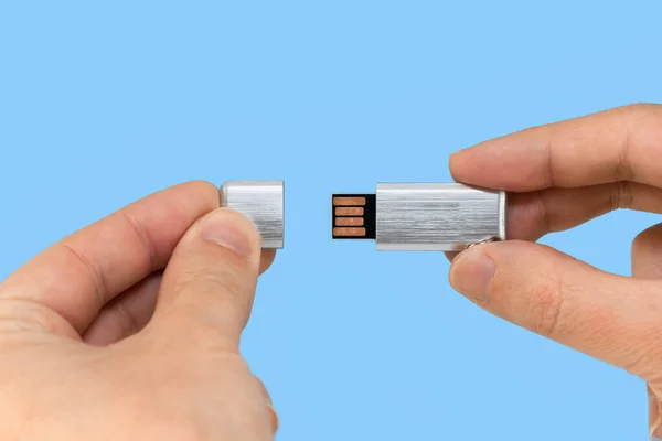 Gray Usb Memory Stick Hand Blue Background Front View — Zdjęcie stockowe