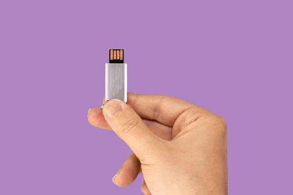 Gray Flash Drive Hand Isolated Violet Background Front View — 스톡 사진