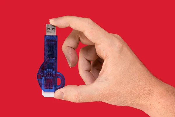 Blue Usb Flash Drive Hand Isolated Red Background Front View — 图库照片