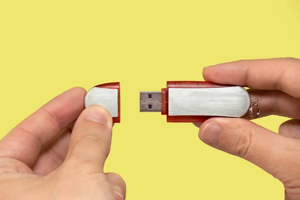 Red Flash Drive Hand Isolated Yellow Background Front View Stok Foto