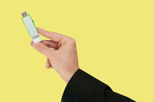 Green Flash Drive Hand Isolated Yellow Background Front View — 스톡 사진