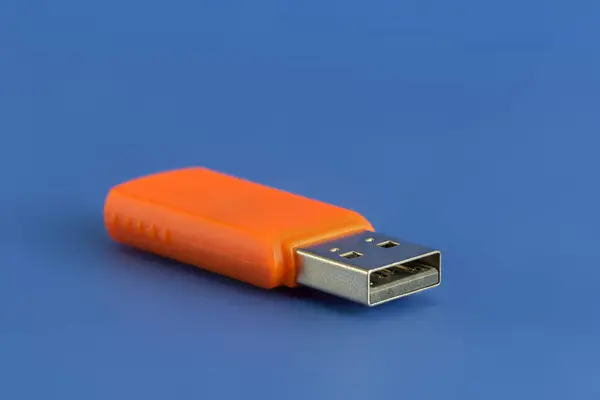 Usb Memory Stick Orange Flash Drive Blue Background Viewed Close — Fotografia de Stock