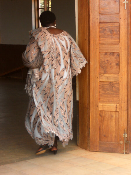 African woman in traditional dress into the church of the Franci