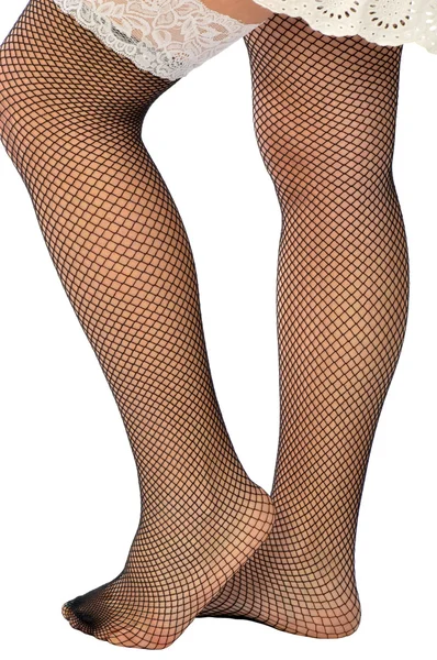 Vrouw in fishnet kousen — Stockfoto