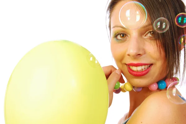 Beautiful girl cheerful  and dynamic between balloons and soap b — Stock Photo, Image