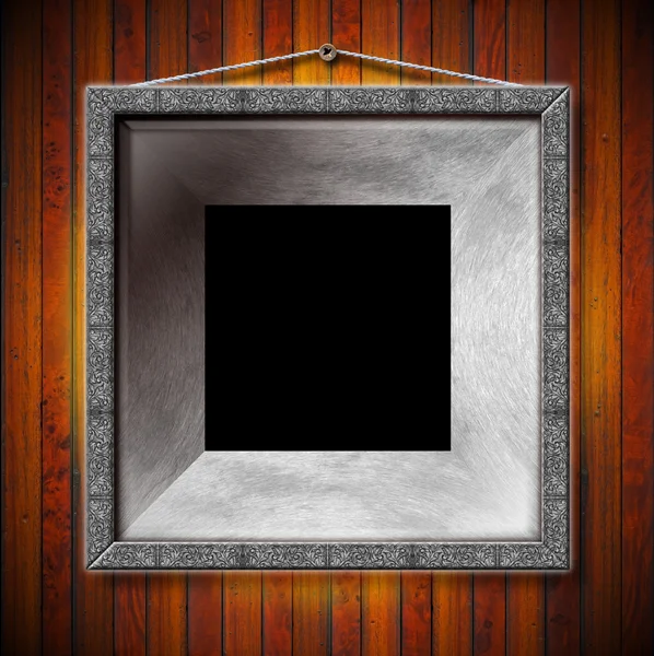 Metal Frame on a Old Wood Wall — Stock Photo, Image