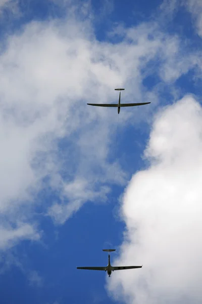Plane Towing a Glider on Blue Sky