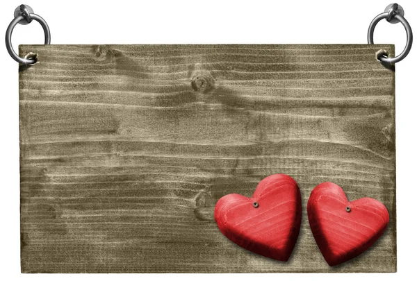 Czerwone serca na szyld drewniany ze ścieżką przycinającą — Zdjęcie stockowe