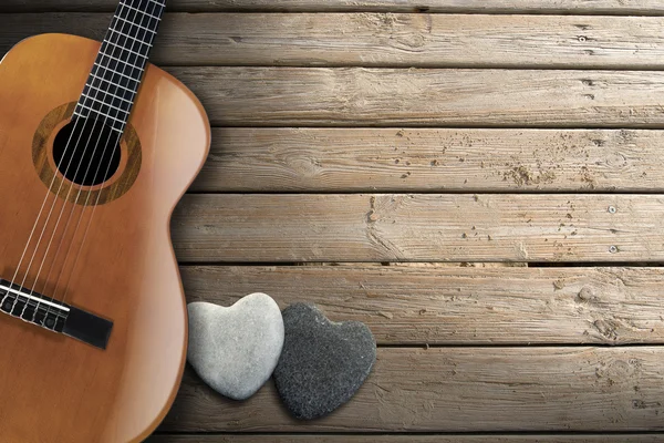 Guitarra acústica en pasarela de madera — Foto de Stock