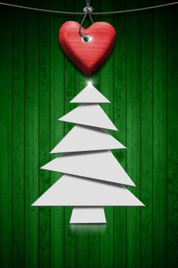 Yeşil ahşap zemin üzerinde stilize Noel ağacı