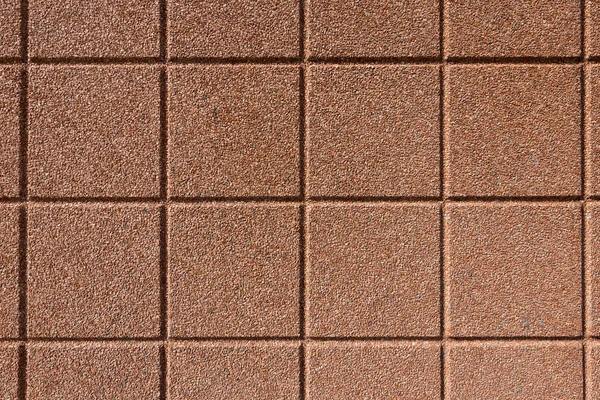 Betonnen oppervlak met kleine steentjes — Stockfoto