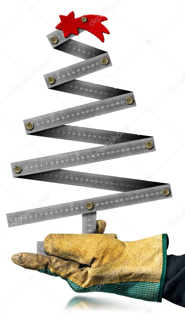 Hand with protective work glove holding a small metallic ruler in the shape of a Christmas tree with a red comet star, isolated on white background