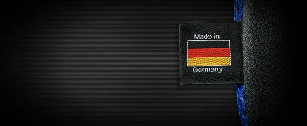 Label German Flag Text Made Germany Sewn Black Fabric Black — Stock Photo, Image