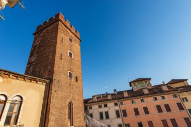 Medieval tower used as a prison called Torre del Girone or Tormento, XII century, part of the famous Basilica Palladiana, Vicenza downtown, Architect Andrea Palladio in Renaissance style, Italy.