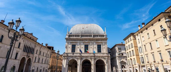 Brescia downtown. Ancient Loggia Palace (Palazzo della Loggia) in Renaissance Style, 1492-1574, Loggia town square (Piazza della Loggia). Lombardy, Italy, Southern Europe.