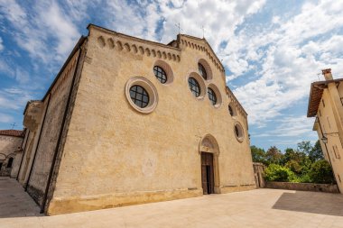 Main facade of the medieval Cathedral of Santa Maria Maggiore in Romanesque Gothic style, 1284-1359. Spilimbergo town, Pordenone province, Friuli-Venezia Giulia, Italy, Europe. 