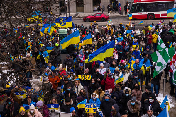 Demonstration support of Ukraine and against the Russian aggression. Protesters, holding banners and Ukrainian flags, against Russia's war in Ukraine. 