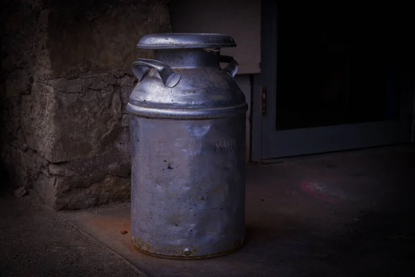 Vintage metal can for milk container in the farm. a jug for milk.