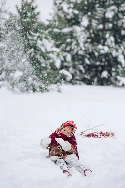 Beautiful Little Child Girl Plays Snowy Forest Snowfall She Dressed — стоковое фото